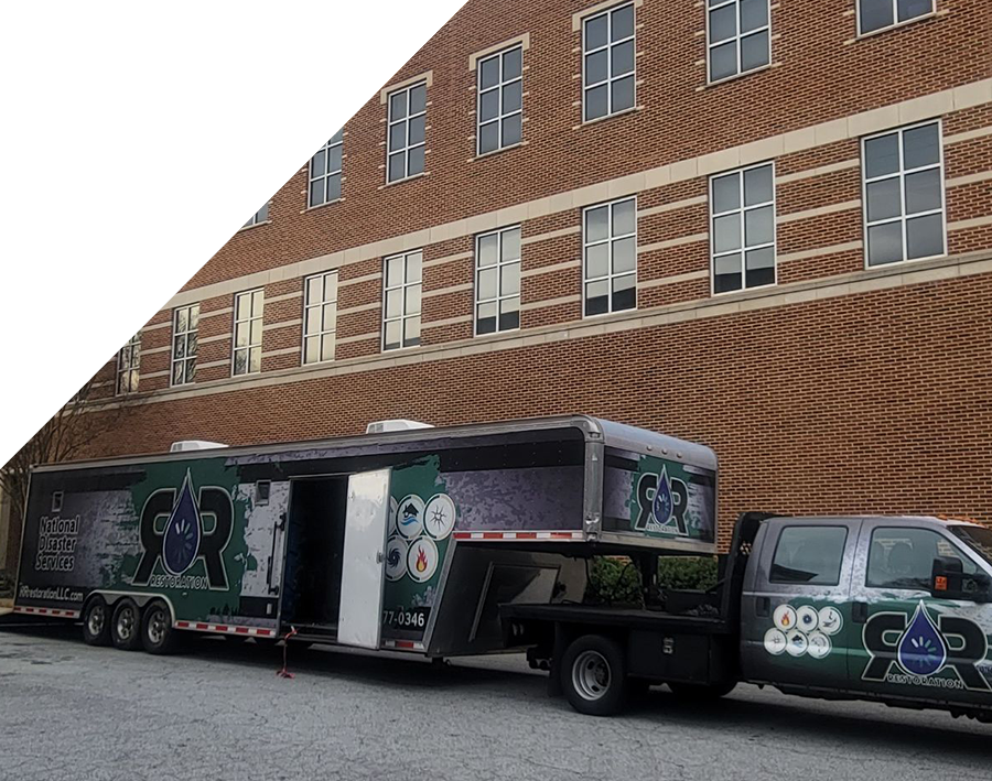 RR Restoration truck and trailer parked outside Mercer building